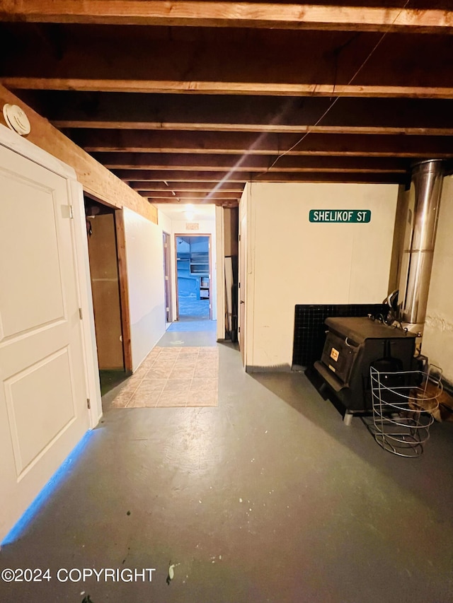 basement featuring a wood stove