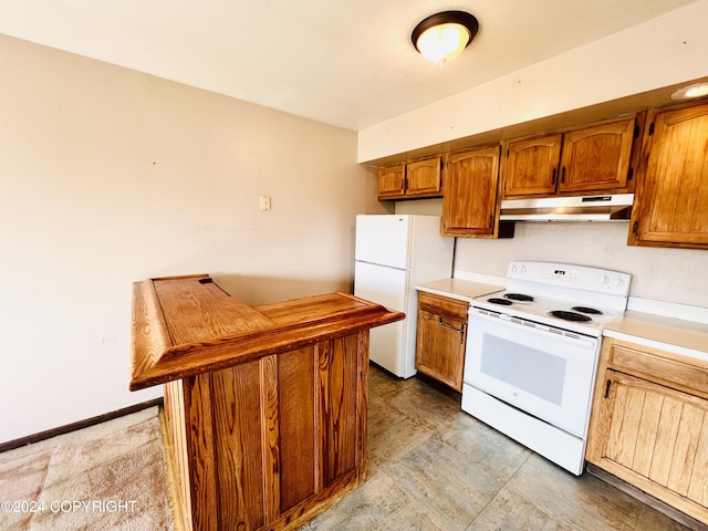 kitchen featuring white appliances and light tile floors