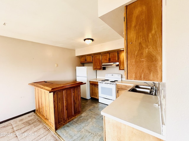 kitchen with sink, white appliances, and light tile floors