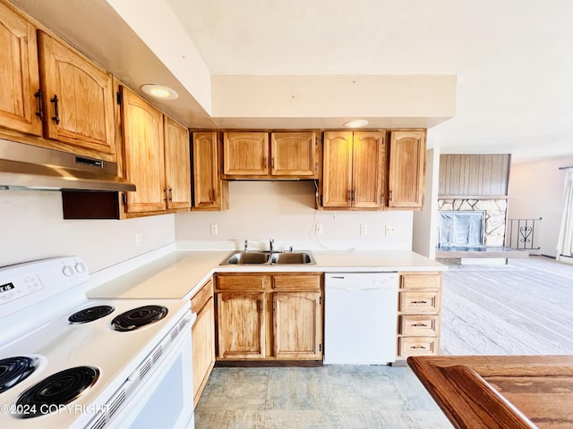 kitchen with white appliances, sink, and light tile flooring