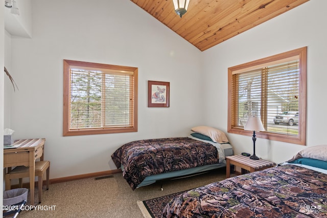 bedroom with carpet, lofted ceiling, wood ceiling, and multiple windows