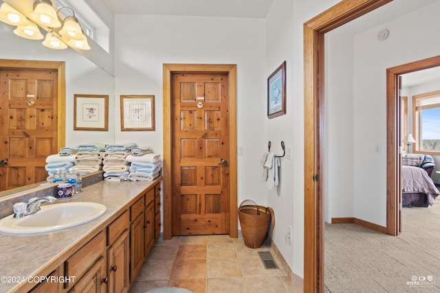 bathroom featuring tile patterned floors and vanity