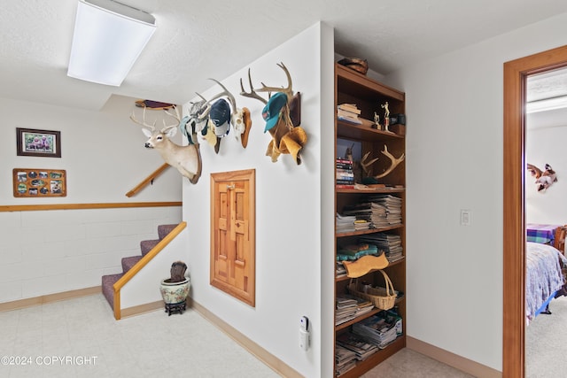 hallway featuring a textured ceiling