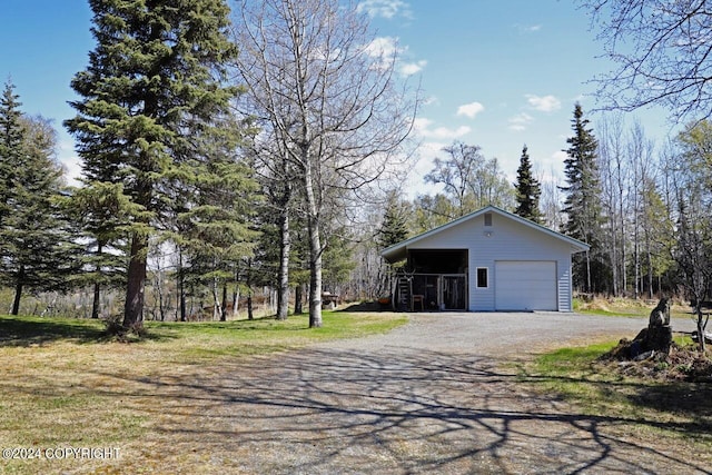 view of property exterior featuring an outbuilding and a garage