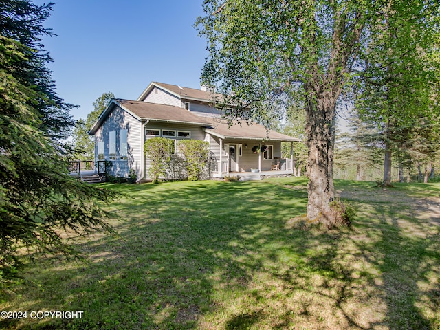 exterior space with a lawn and covered porch