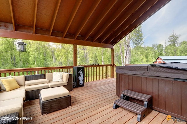 wooden terrace with outdoor lounge area and a hot tub