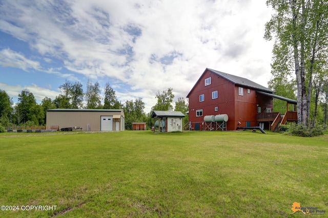 view of yard with a garage and a storage shed