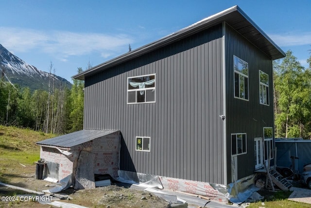 view of property exterior featuring a mountain view