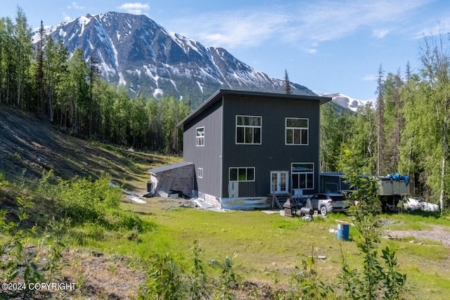 back of house with a mountain view