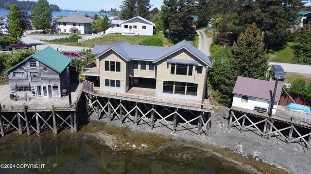 back of property with a water view