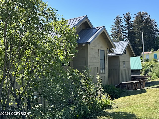 view of home's exterior featuring a yard