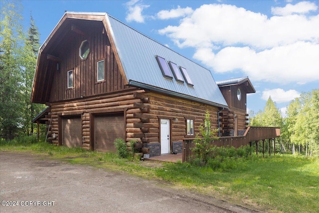 view of side of property with a garage