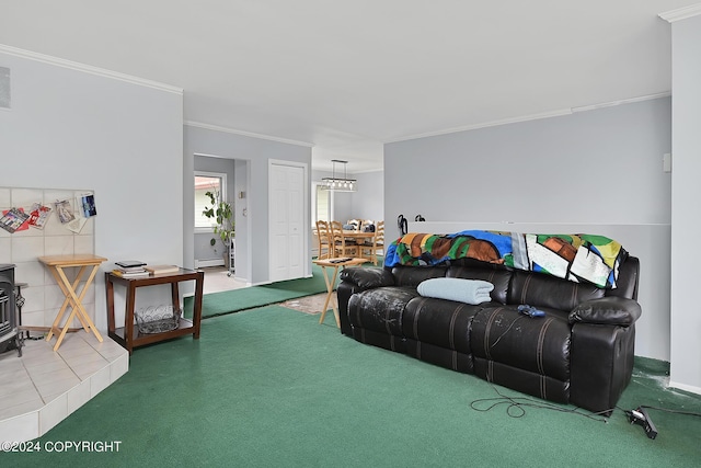 living room with crown molding, baseboard heating, and carpet