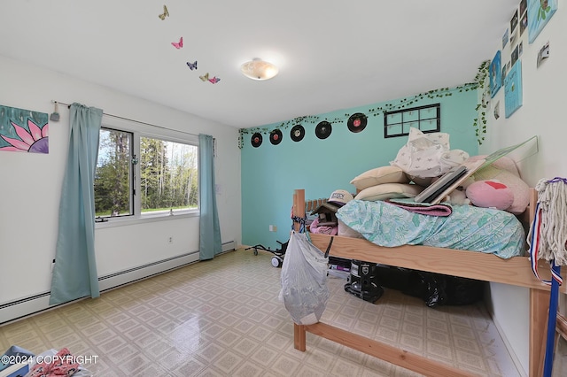 bedroom featuring a baseboard heating unit