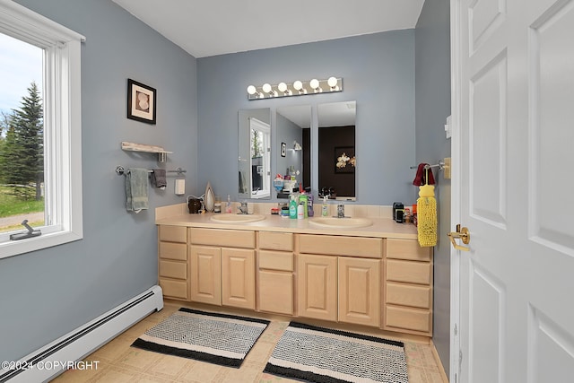 bathroom featuring vanity and a baseboard heating unit