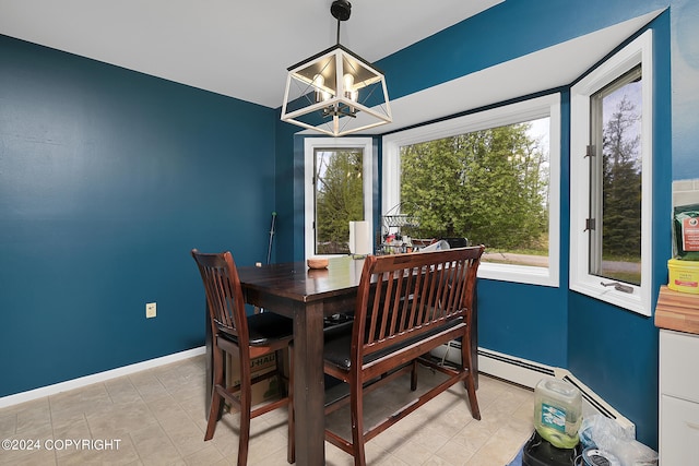 dining space with an inviting chandelier