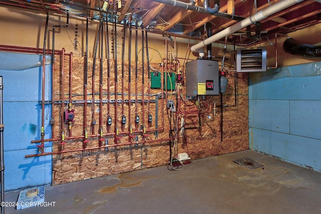 utility room featuring water heater