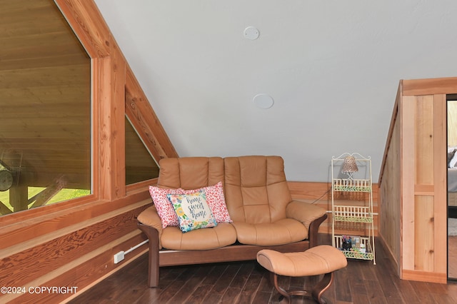 living room with wood walls and hardwood / wood-style floors