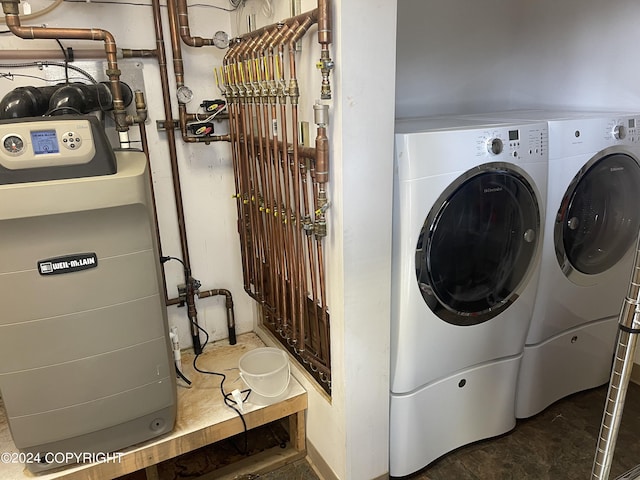 clothes washing area featuring washer and dryer