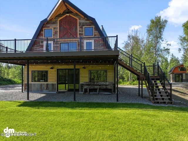 back of house with a lawn and a wooden deck