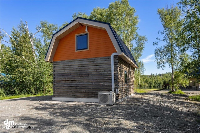 view of home's exterior with central AC unit