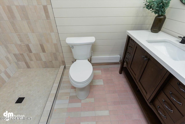 bathroom featuring tile patterned flooring, vanity, and toilet