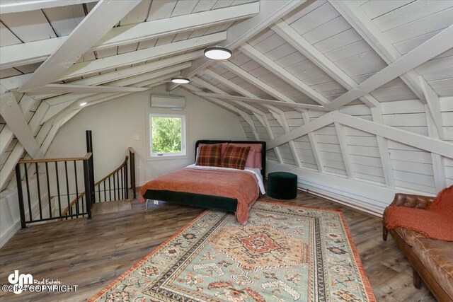 bedroom featuring a wall mounted air conditioner, dark hardwood / wood-style floors, and lofted ceiling with beams