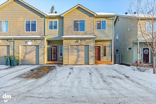 townhome / multi-family property featuring a garage