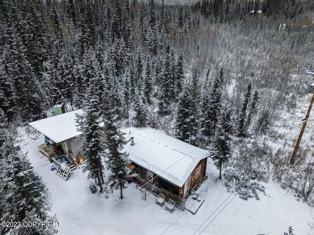 snowy aerial view with a view of trees