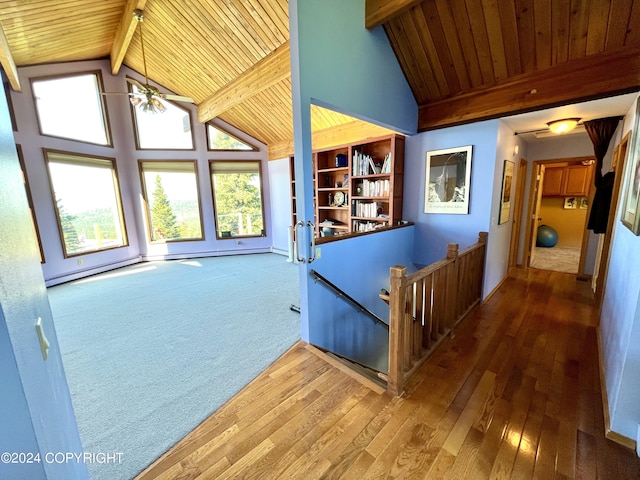 17041 Jacqueline Cir, Anchorage, AK 99516 - hall with wooden ceiling with exposed beams, an upstairs landing, healthy amount of natural light, hardwood / wood-style floors, and high vaulted ceiling