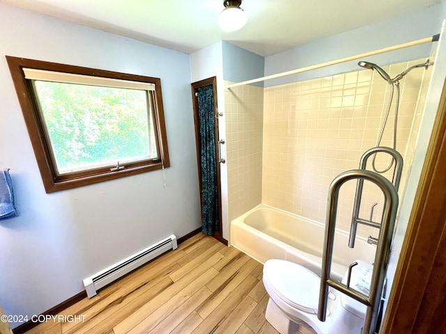 17041 Jacqueline Cir, Anchorage, AK 99516 - full bath featuring a baseboard heating unit, toilet, wood finished floors, shower / bath combo, and baseboards
