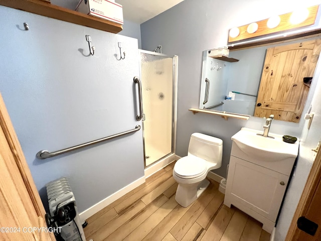17041 Jacqueline Cir, Anchorage, AK 99516 - full bath featuring wood finished floors, a shower stall, vanity, and toilet