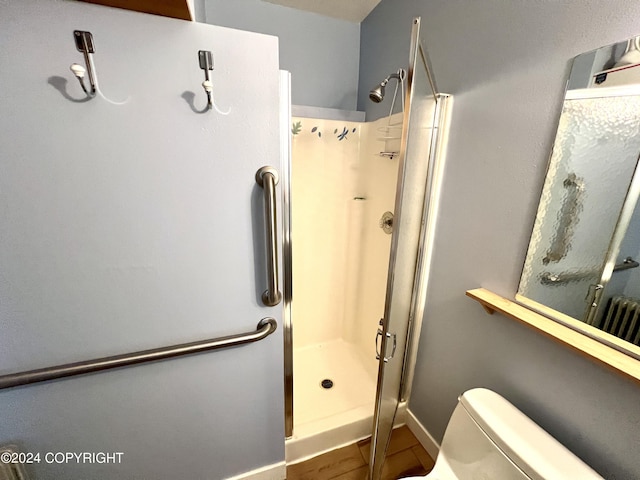 17041 Jacqueline Cir, Anchorage, AK 99516 - full bath with a stall shower, toilet, and baseboards
