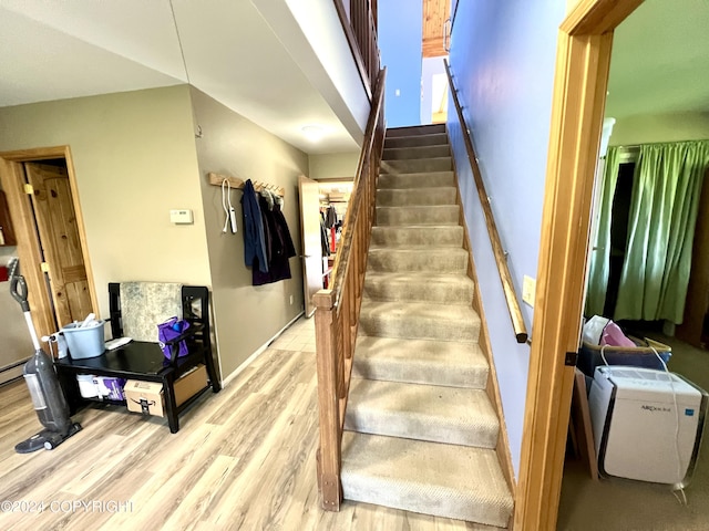 17041 Jacqueline Cir, Anchorage, AK 99516 - staircase with wood finished floors and baseboards