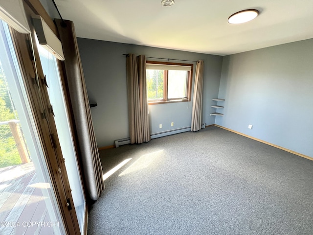 17041 Jacqueline Cir, Anchorage, AK 99516 - carpeted spare room with a baseboard heating unit and baseboards