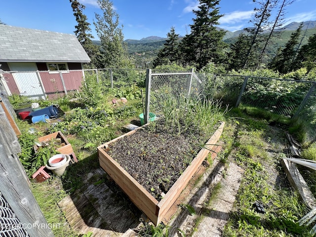 17041 Jacqueline Cir, Anchorage, AK 99516 - view of yard with a garden and a mountain view
