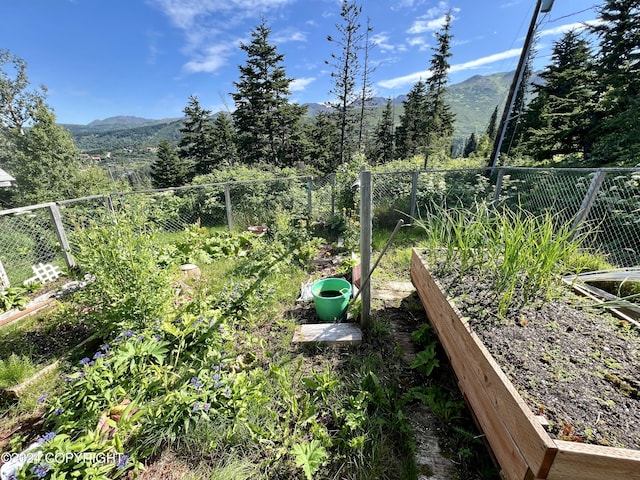 17041 Jacqueline Cir, Anchorage, AK 99516 - view of yard featuring a vegetable garden and a mountain view