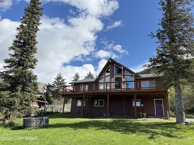 17041 Jacqueline Cir, Anchorage, AK 99516 - rear view of house featuring a wooden deck and a lawn