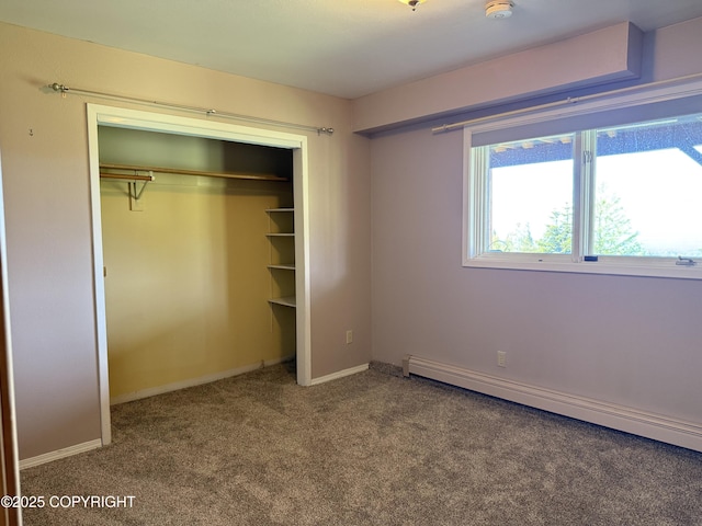 17041 Jacqueline Cir, Anchorage, AK 99516 - unfurnished bedroom featuring a baseboard radiator, carpet floors, a closet, and baseboards
