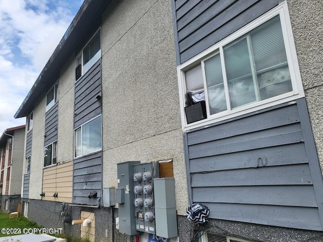 view of property exterior featuring a mail area