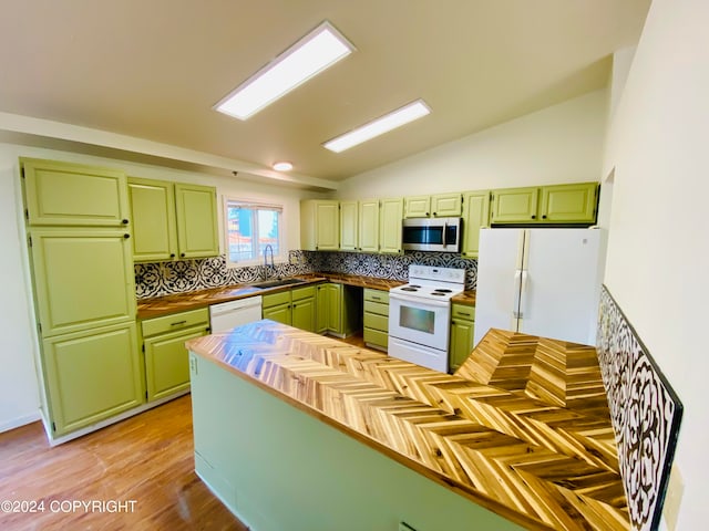 kitchen with tasteful backsplash, vaulted ceiling, light hardwood / wood-style flooring, green cabinetry, and white appliances