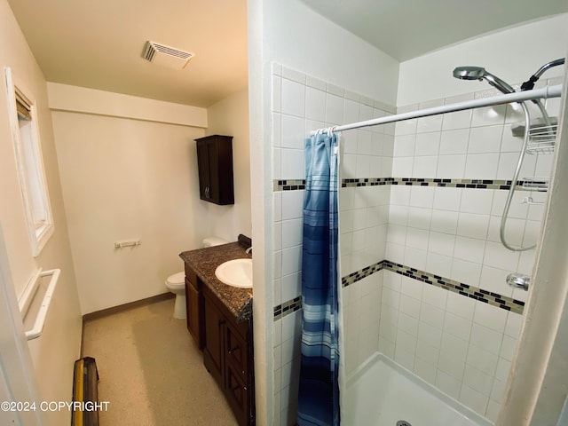 bathroom featuring vanity, toilet, and a shower with shower curtain