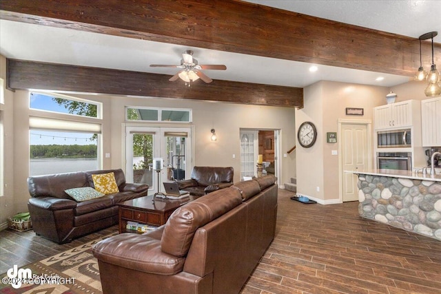 living room with french doors, ceiling fan, and beam ceiling