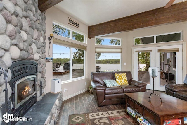 living room featuring beam ceiling, dark wood-type flooring, and french doors