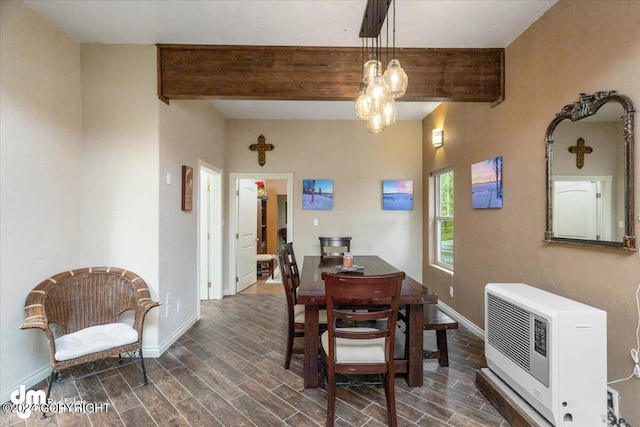 dining space with heating unit and beam ceiling