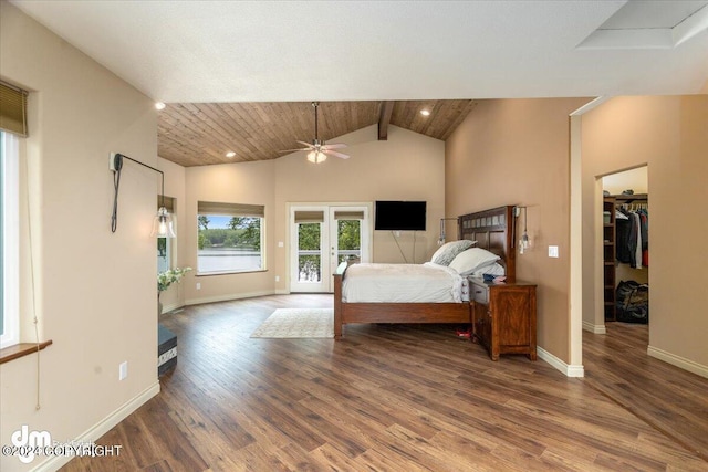 bedroom featuring french doors, wood ceiling, a walk in closet, access to outside, and hardwood / wood-style flooring