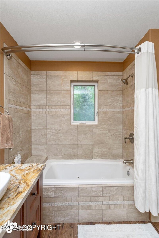 bathroom featuring vanity and shower / bath combo with shower curtain