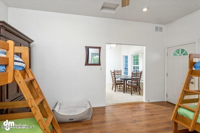 bedroom with hardwood / wood-style floors