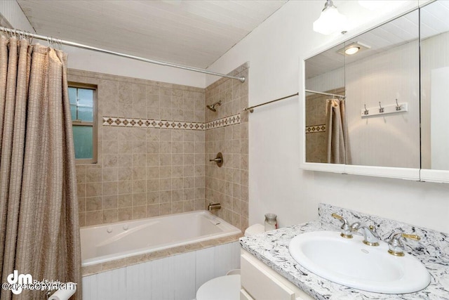 full bathroom with shower / bath combination with curtain, vanity, and toilet