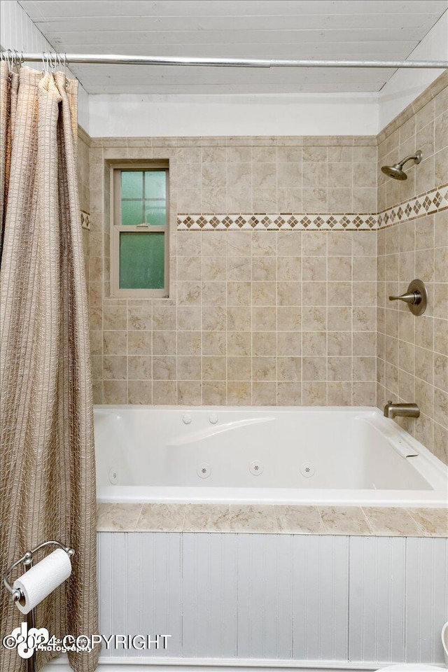 bathroom featuring shower / bath combo with shower curtain